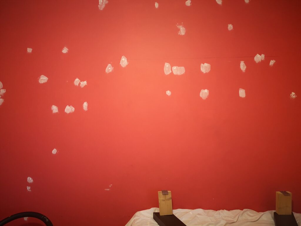 Red wall with white filler spots